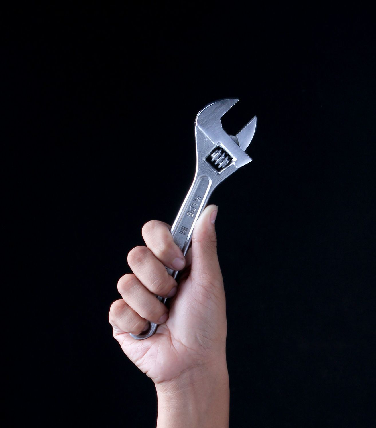 person holding gray and black metal tool